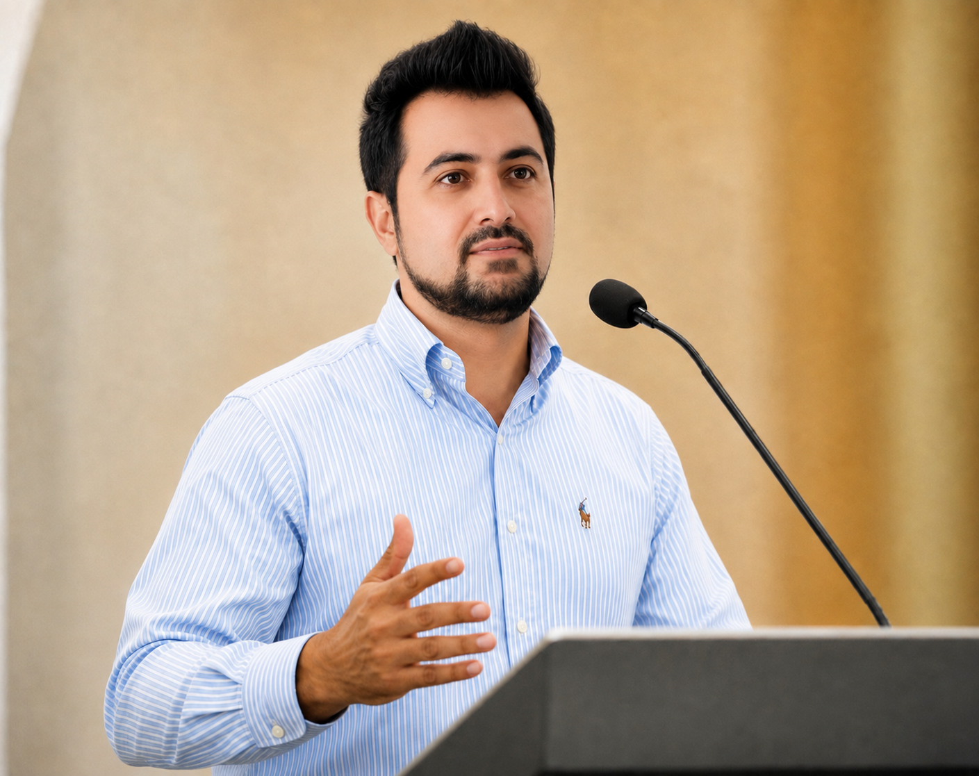 A. Salam Shinwary speaking at a community podium